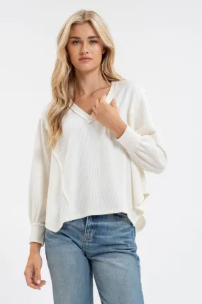 V NECK ASYMMETRICAL HEM LONG SLEEVE KNIT TOP