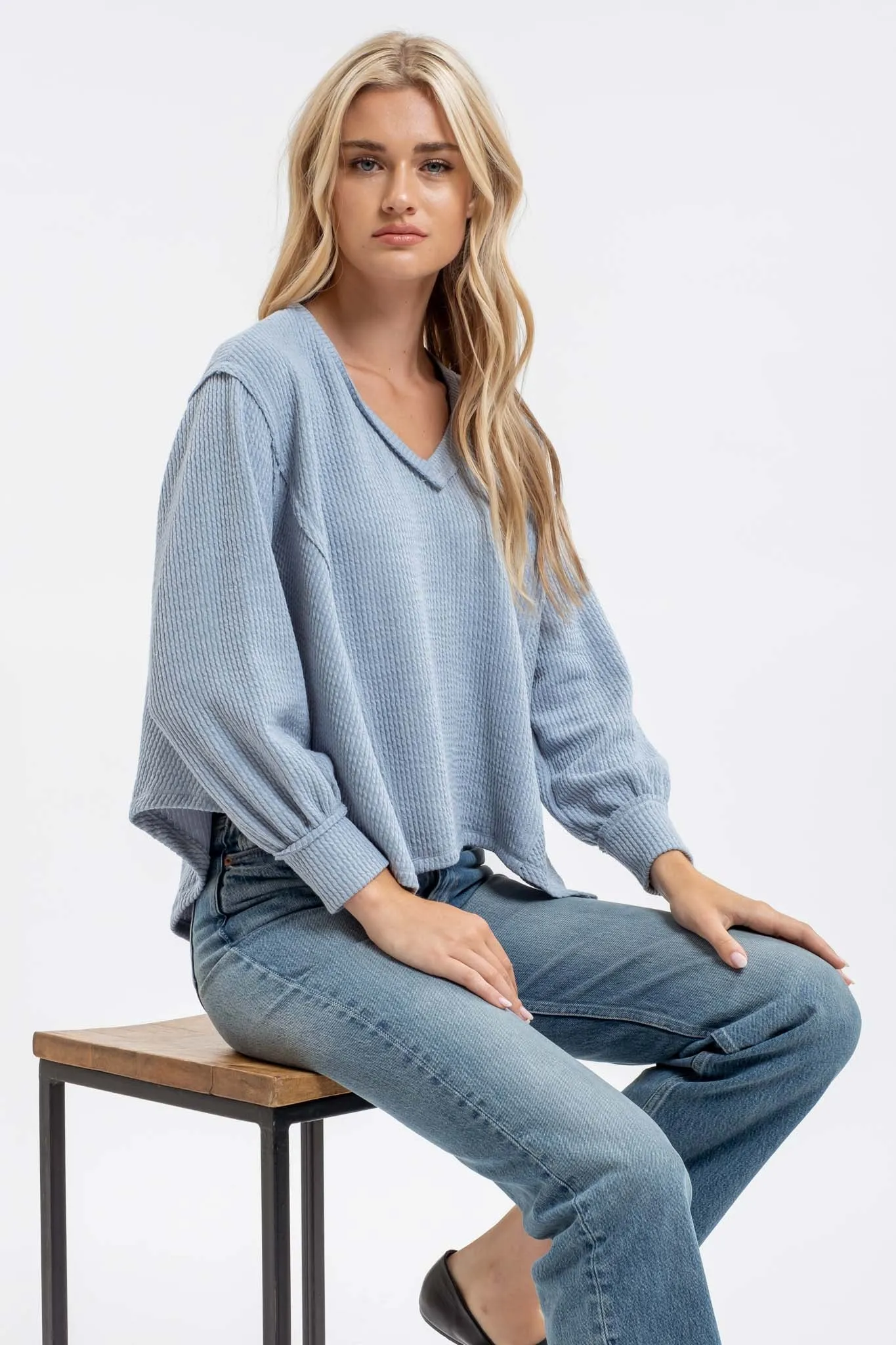 V NECK ASYMMETRICAL HEM LONG SLEEVE KNIT TOP