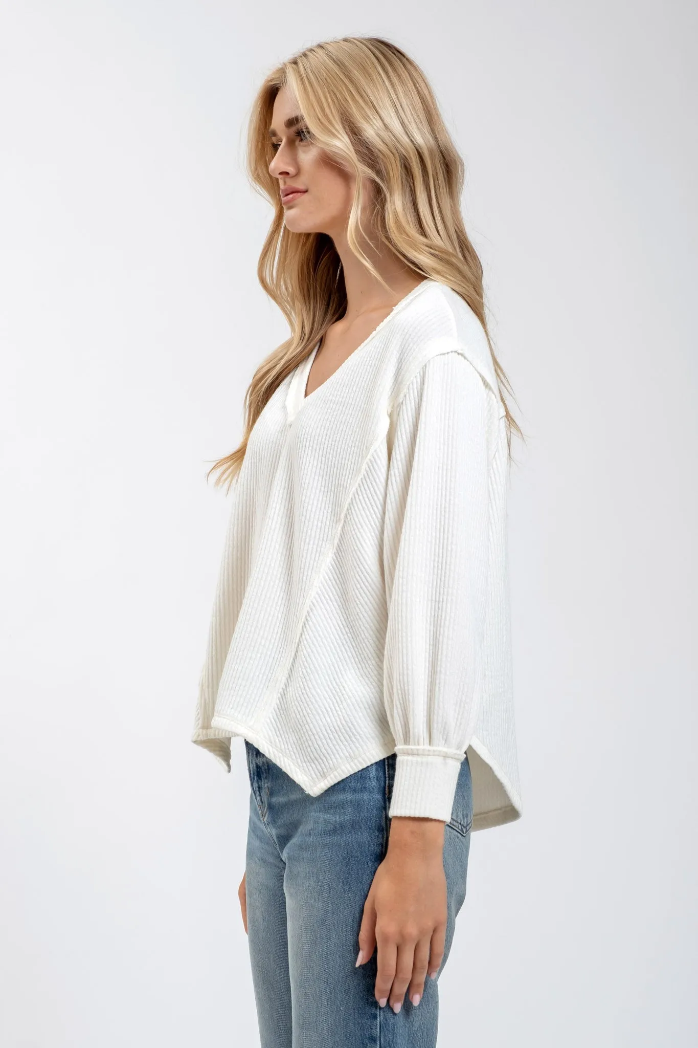 V NECK ASYMMETRICAL HEM LONG SLEEVE KNIT TOP